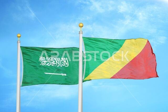 Saudi Arabia and Congo two flags on flagpoles and blue cloudy sky