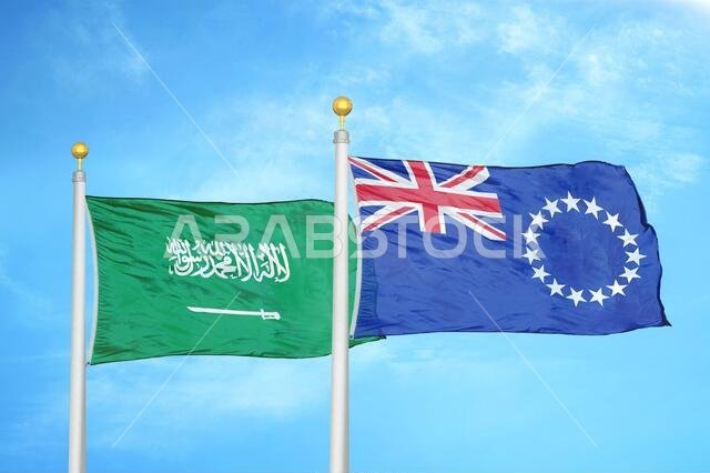 Saudi Arabia and Cook Islands two flags on flagpoles and blue cloudy sky