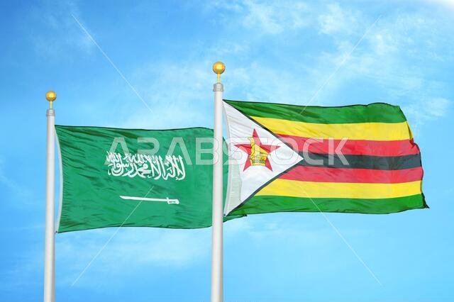 المملكة العربية السعودية وزيمبابوي، علمان على ساريتين وسماء زرقاء ملبدة بالغيوم المملكة العربية السعودية وزيمبابوي، علمان على ساريتين وسماء زرقاء ملبدة بالغيوم