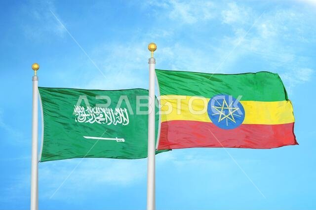 Saudi Arabia and Ethiopia two flags on flagpoles and blue cloudy sky