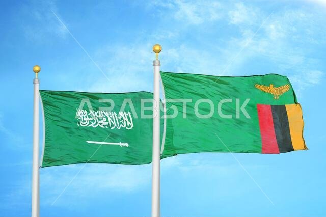 المملكة العربية السعودية وزامبيا، علمان على ساريتين وسماء زرقاء ملبدة بالغيوم