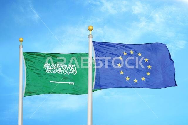 Saudi Arabia and European Union two flags on flagpoles and blue cloudy sky