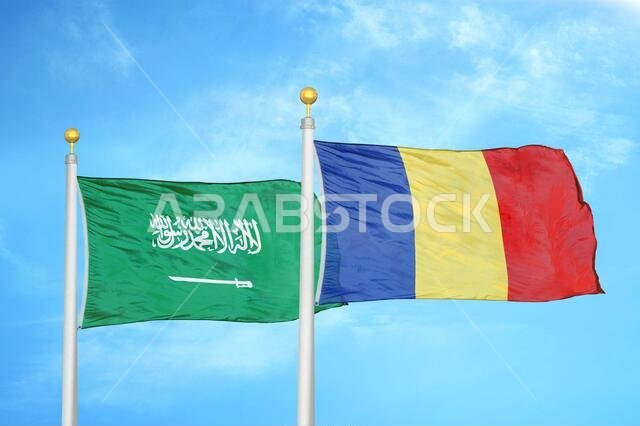 Saudi Arabia and Romania two flags on flagpoles and blue cloudy sky