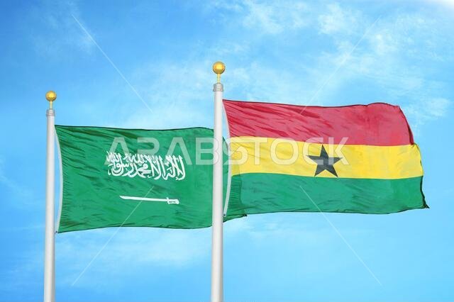 Saudi Arabia and Ghana two flags on flagpoles and blue cloudy sky