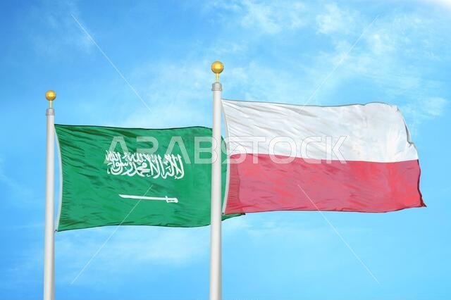 Saudi Arabia and Poland two flags on flagpoles and blue cloudy sky