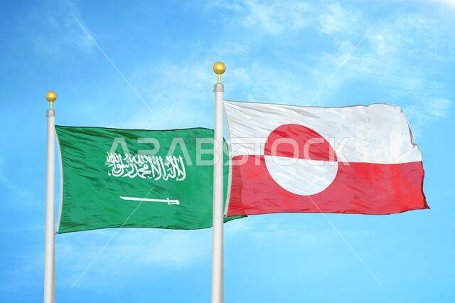 Saudi Arabia and Greenland two flags on flagpoles and blue cloudy sky