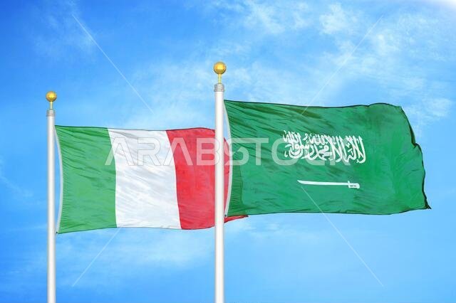 Italy and Saudi Arabia two flags on flagpoles and blue cloudy sky