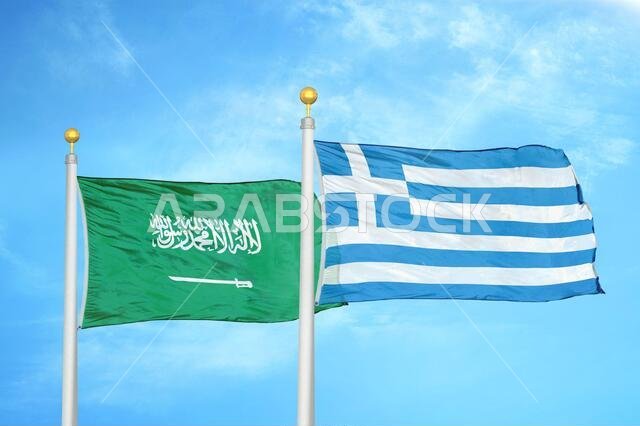 Saudi Arabia and Greece two flags on flagpoles and blue cloudy sky