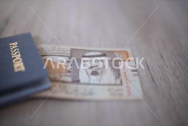 Ten Saudi Riyals Bill Partially Inside a United States of America Passport