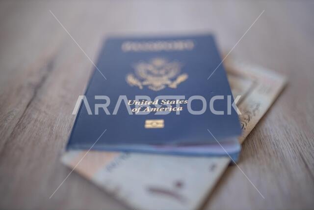 United States of America Passport with a Ten Saudi Riyals Bill Inside