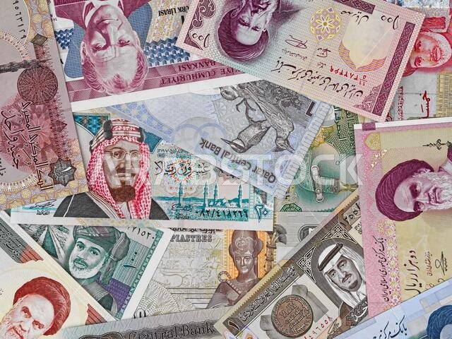 Middle east money, heap of various middle east banknotes, currency background