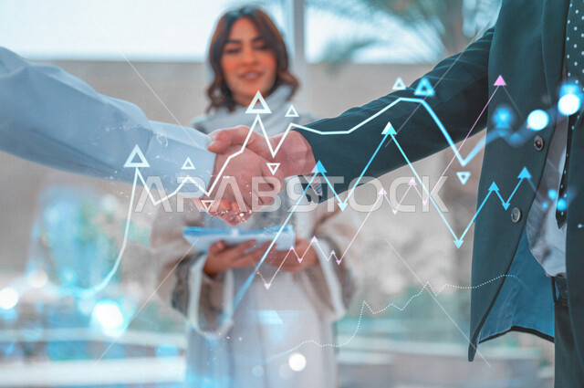 Two businessmen shake hands to complete a profitable deal, a business agreement, a project and a new business plan, business partners, progress and success, a Saudi company with high efficiency, hologram graphics.