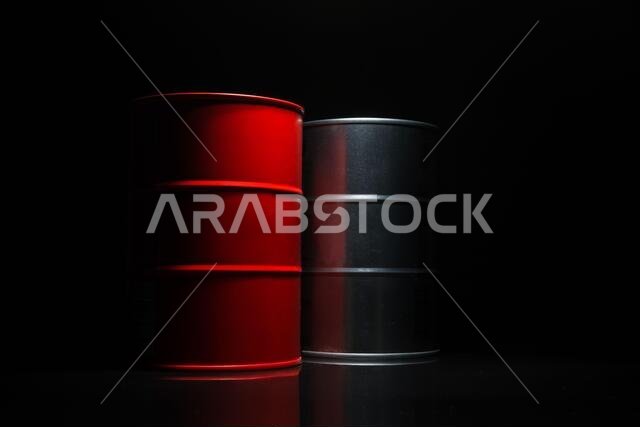 Red and metall barrel of oil on a black background for design. Red and metall barrel of oil on a black background for design.