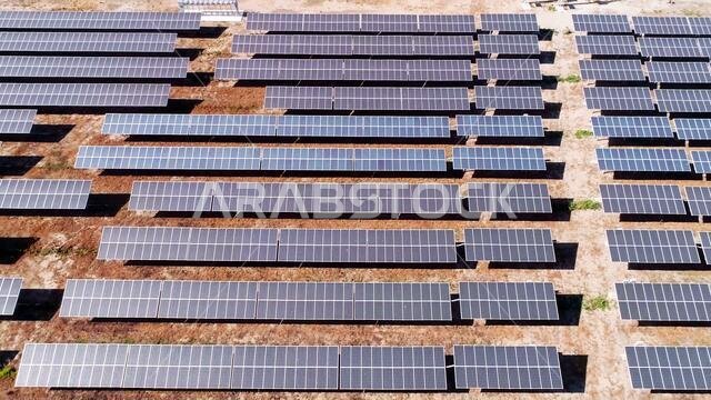 aerial view of a Solar Energy, Solar cell panels field from above in desert.