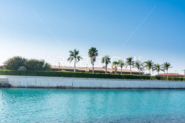 Luxury villa with palm trees in the resort of Jeddah Corniche, 30 km coastal resort area of Jeddah city with coastal road, recreation areas, pavilions