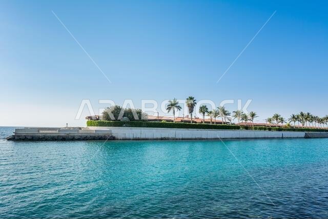 Luxury villa with palm trees in the resort of Jeddah Corniche, 30 km coastal resort area of Jeddah city with coastal road, recreation areas, pavilions