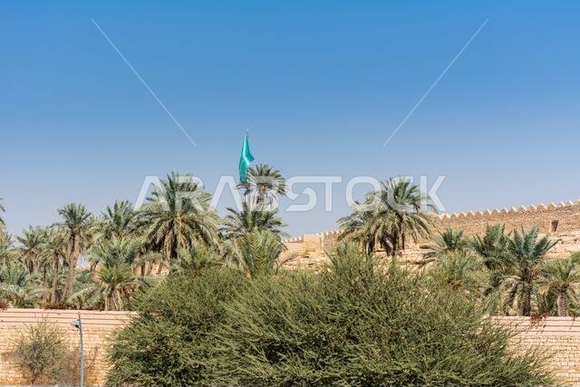 Date trees and ruins of Diraiyah clay castle, also as Dereyeh and Dariyya, a town in Riyadh, Saudi Arabia, was the original home of the Saudi royal fa