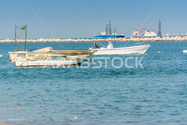 Fishing boat floating at the sea at the corniche park, Dammam, Saudi Arabia