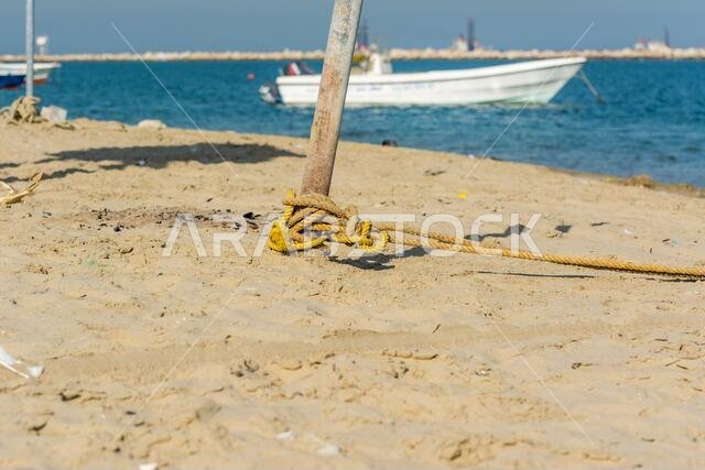 Ropes on a timber pole at the beach at the corniche park in Dammam, Kingdom of Saudi Arabia