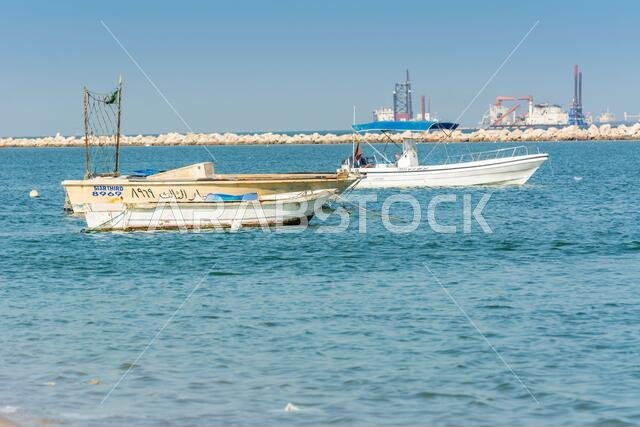 Fishing boat floating at the sea at the corniche park, Dammam, Saudi Arabia