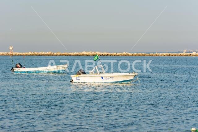 Fishing boat floating at the sea at the corniche park, Dammam, Saudi Arabia