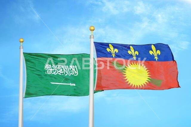 المملكة العربية السعودية وغوادلوب، علمان على ساريتين وسماء زرقاء ملبدة بالغيوم