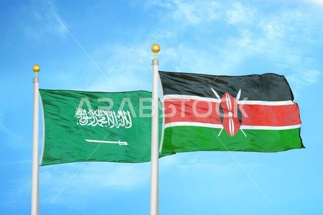 Saudi Arabia and Kenya two flags on flagpoles and blue cloudy sky