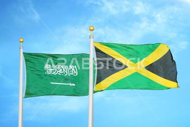 السعودية وجامايكا، علمان على سارية علم وسماء زرقاء ملبدة بالغيوم