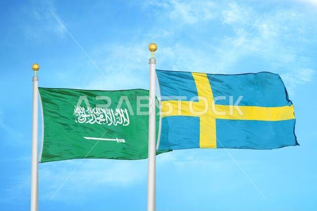 Saudi Arabia and Sweden two flags on flagpoles and blue cloudy sky