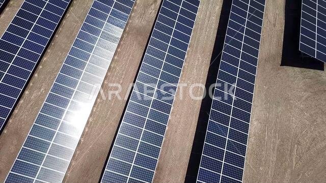solar power panels in the desert. aerial top above view of photovoltaic PV modules in a Solar energy plant farm background