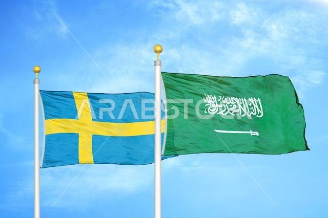 Sweden and Saudi Arabia two flags on flagpoles and blue sky