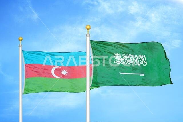 Azerbaijan and Saudi Arabia two flags on flagpoles and blue sky