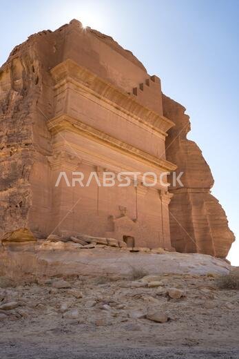 Picturesque scenery of tombs carved into sandstone cliffs as architecture and archeological site in Saudi Arabia