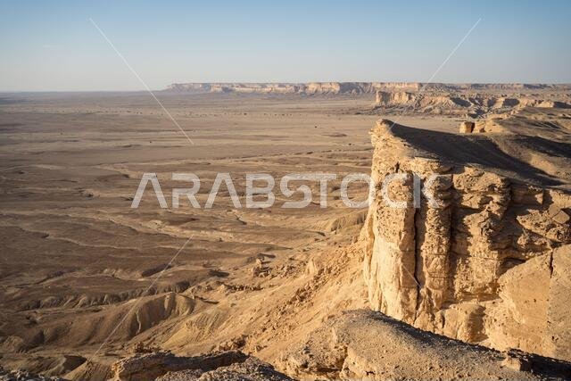 From above picturesque scenery of majestic range of cliffs in desert location in the Edge of the World in Saudi Arabia