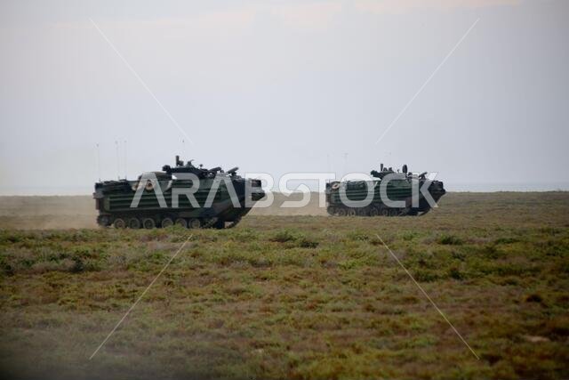 200422-M-CB805-1003 منطقة عمليات الأسطول الخامس الأمريكي (22 أبريل 2020) - مركبات برمائية هجومية تابعة لسرية غولف، فريق الإنزال الكتائبي 2/8، وحدة المشاة البحرية الاستكشافية 26، تُناور باتجاه هدف خلال تدريب على هجوم برمائي في جزيرة كاران، المملكة العربية السعودية، في 22 أبريل 2020. وتقوم مجموعة باتان البرمائية الجاهزة ووحدة المشاة البحرية الاستكشافية 26، بدعم من القوة الجوية لعنصر القتال الجوي التابع لمجموعة باتان البرمائية الجاهزة ووحدة المشاة البحرية الاستكشافية، بما في ذلك طائرات هارير AV-8B 