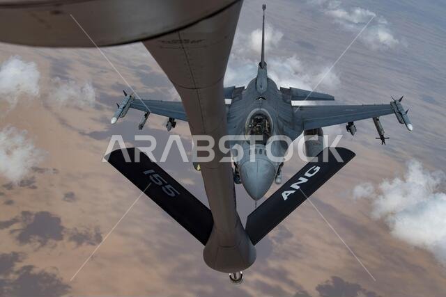 A U.S. Air Force F-16 Fighting Falcon approaches a U.S. Air Force KC-135 Stratotanker to conduct an aerial refueling operation above the Kingdom of Saudi Arabia, April 23, 2020. The KC-135 enables global reach for U.S. and coalition aircraft, providing war-winning air power throughout the U.S. Central Command area of responsibility. (U.S. Air Force photo by Staff Sgt. Daniel Snider)