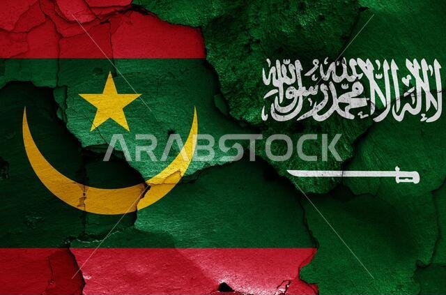 flags of Mauritania and Saudi Arabia painted on cracked wall