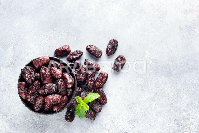 Dried Red Dates On Concrete Background, Table Top View Healthy Vegan Dried Fruit. Copy Space For Text