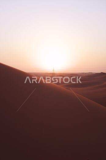 Portrait vertical shot of beautiful sunrise on the red sand dunes of the Al Dahna Desert in Riyadh, Saudi Arabia. New beginnings, symbol of hope and brighter tomorrow.