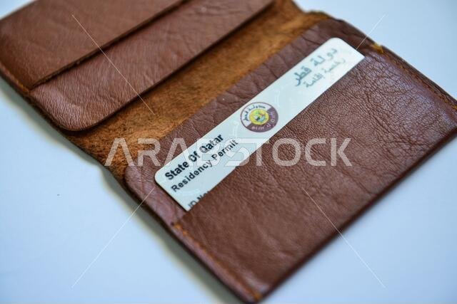 Qatar ID card & Medical Card in Brown Valet on white background