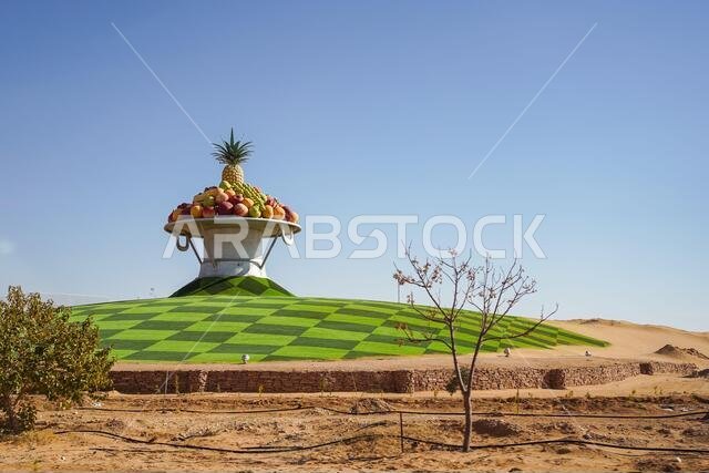Sakakah / Saudi Arabia - January 20, 2020: beautiful roundabout decorated with colorful fruit monument in Saudi Arabia