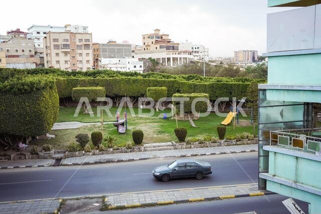 Abha / Saudi Arabia - January 23, 2020: beautiful playground with green grass and surrounded by well-kept green hedges