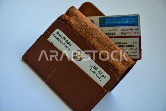Qatar ID card & Medical Card in Brown Valet on white background
