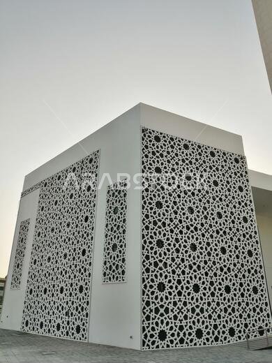 Muslim mosque with modern Arabesque pattern. Associated with ancient Islamic civilization the design features repetitive geometric forms or shapes.