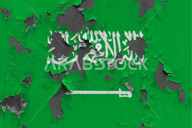صورة مقرّبة لعلم المملكة العربية السعودية، مطليّ، متضرر، ومتسخ على جدار، يتقشّر الطلاء منه ليكشف عن سطح الخرسانة. مفهوم وطني كلاسيكي. صورة مقرّبة لعلم المملكة العربية السعودية، مطليّ، متضرر، ومتسخ على جدار، يتقشّر الطلاء منه ليكشف عن سطح الخرسانة. مفهوم وطني كلاسيكي.