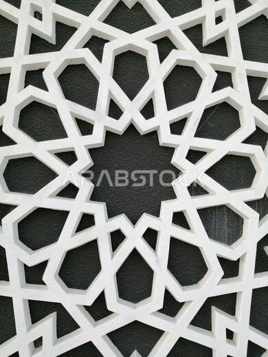 Modern Arabesque pattern background. Associated with ancient Islamic civilization the beautiful design features repetitive geometric forms or shapes.