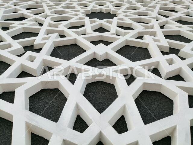 Modern Arabesque pattern background. Associated with ancient Islamic civilization the beautiful design features repetitive geometric forms or shapes.
