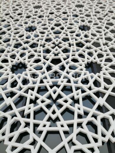 Modern Arabesque pattern background. Associated with ancient Islamic civilization the beautiful design features repetitive geometric forms or shapes.
