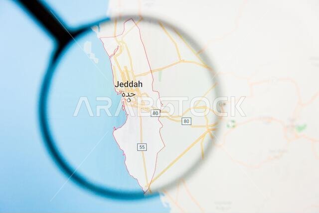 مفهوم توضيحي لمدينة جدة، المملكة العربية السعودية، معروض على شاشة العرض من خلال عدسة مكبرة