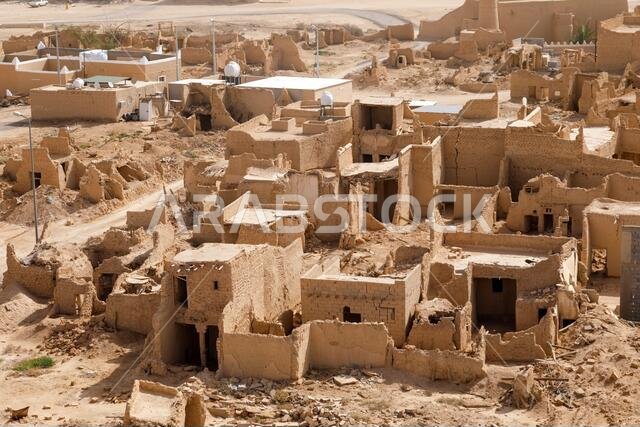 View of the small village Raghba with the abandoned mud houses in the middle of the desert in Saudi Arabia